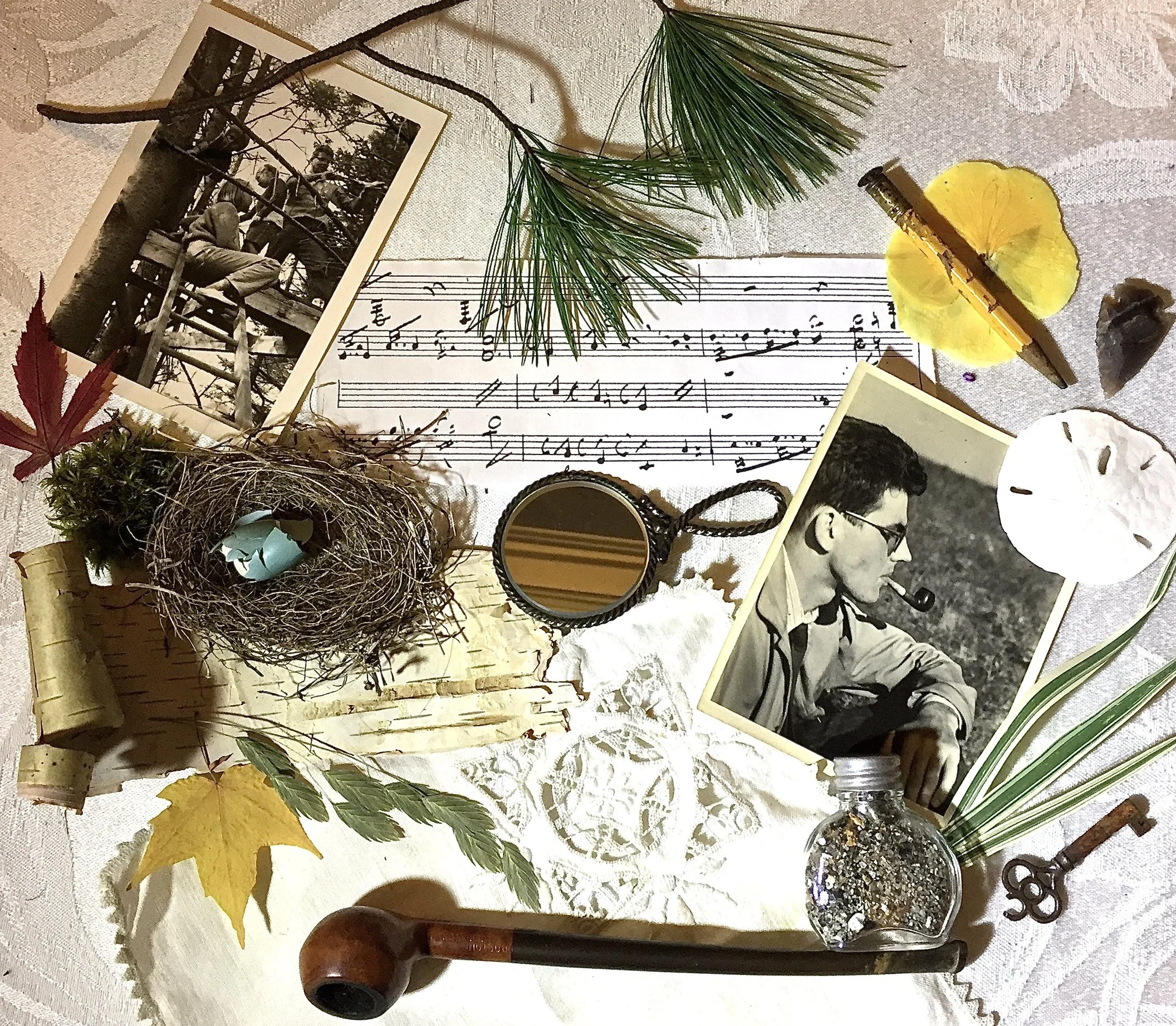 Collage wh memorabilia and photos, bird's nest, pipe, key, old pencil