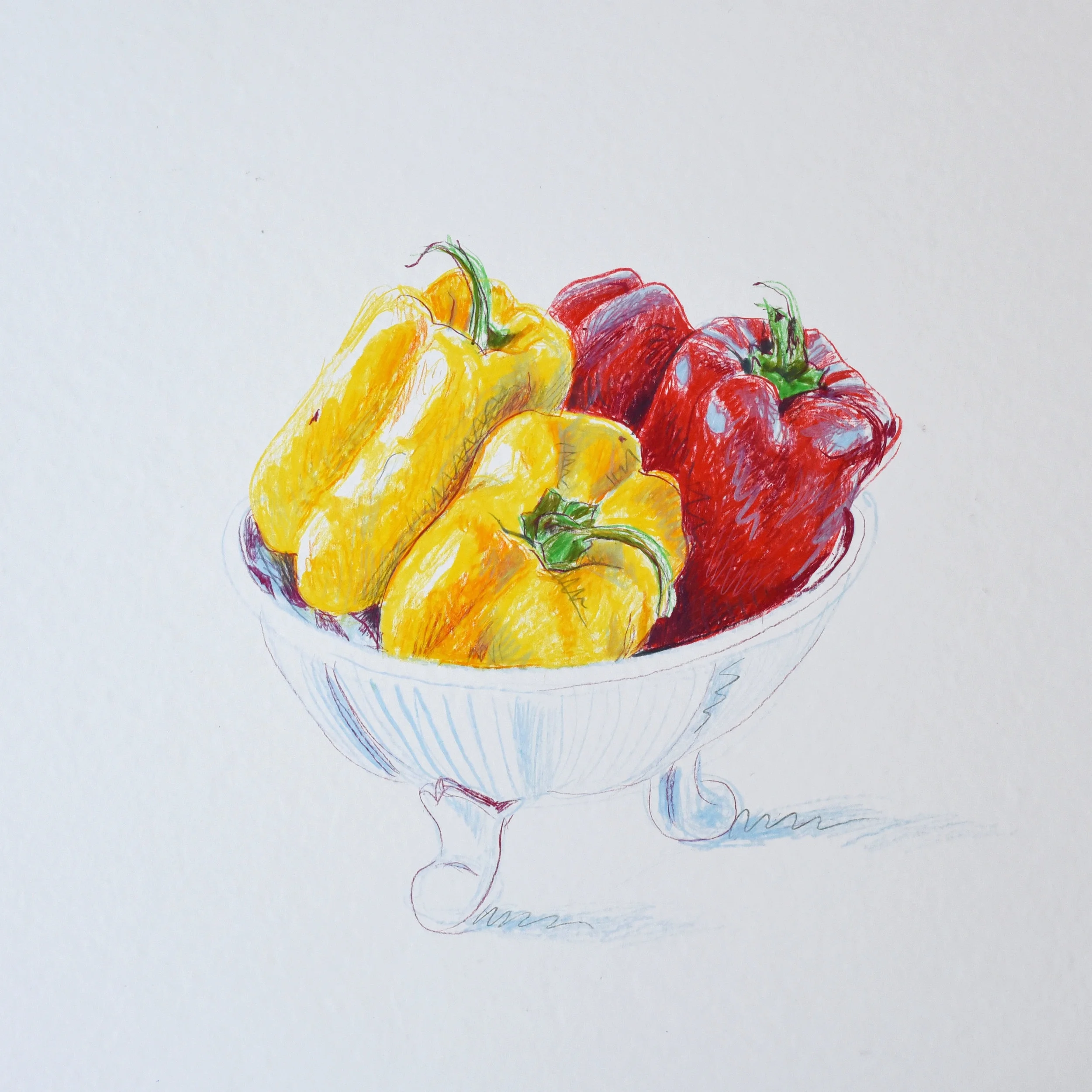 Still life of red and yellow peppers in a bowl