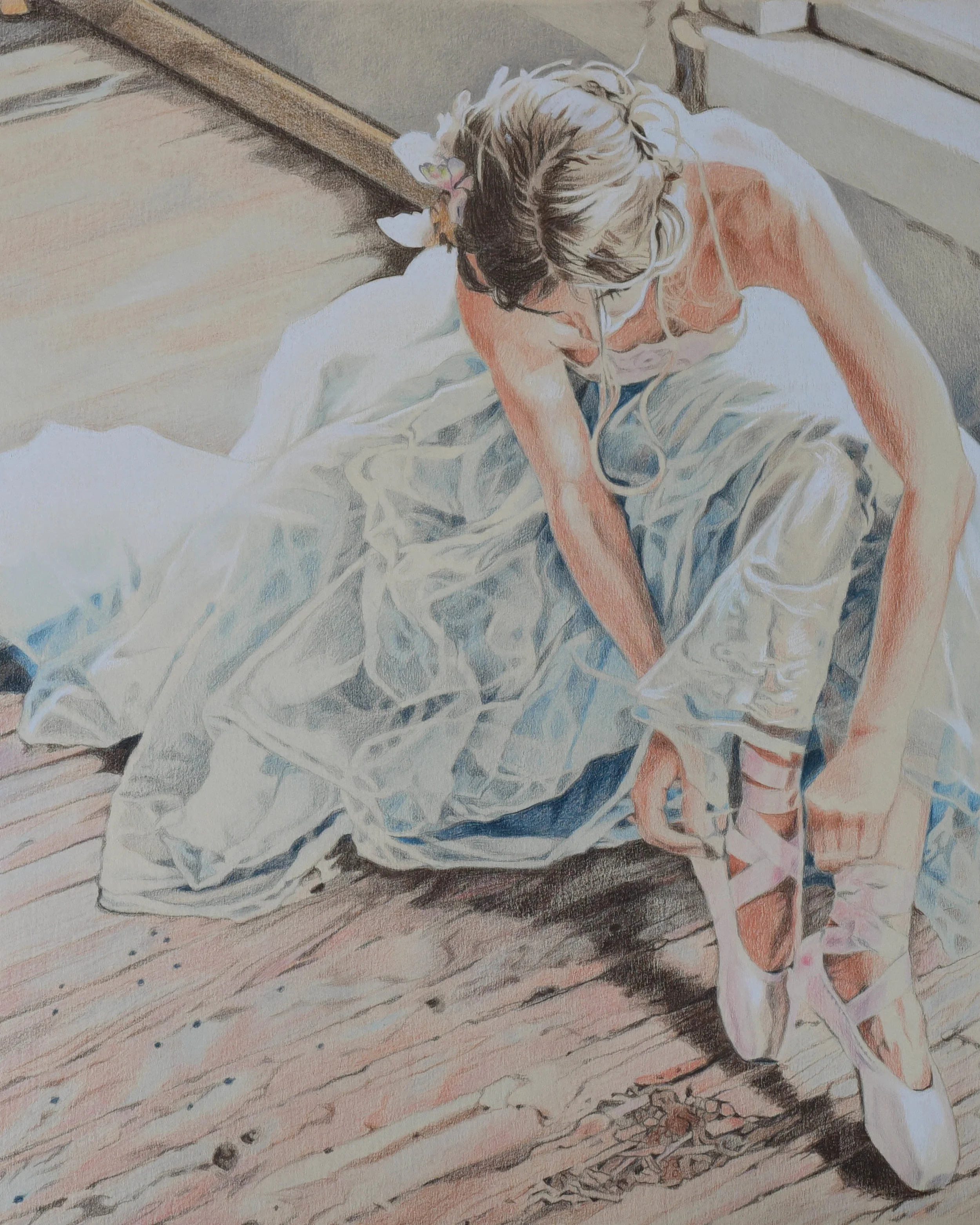 Colour pencil portrait of a ballerina in pointe shoes wearing a tutu.