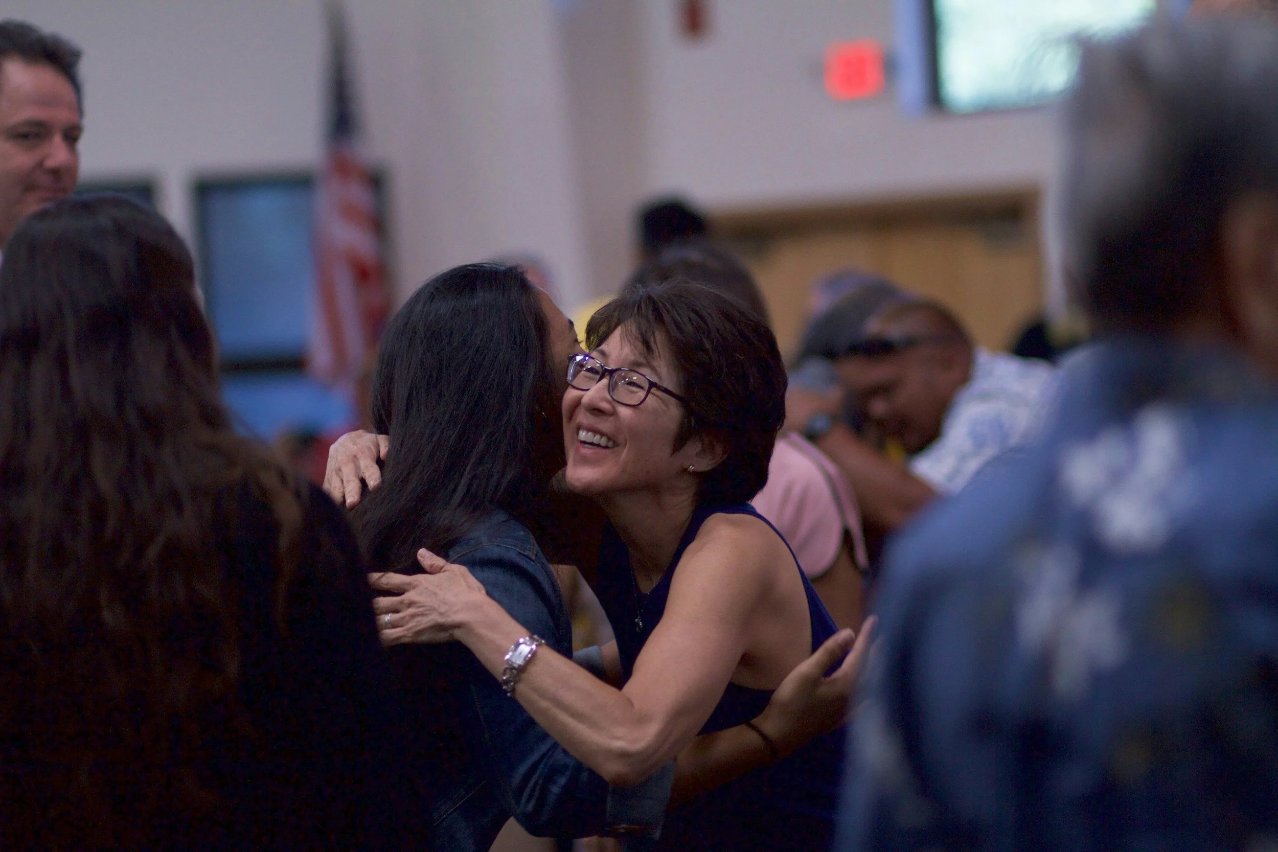 Two people embracing warmly, representing real embodied connection