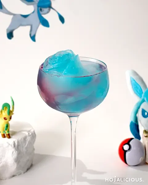 Gradient blue-violet butterfly pea mocktail with cotton candy jelly and lemon, a refreshing and photogenic summer drink.