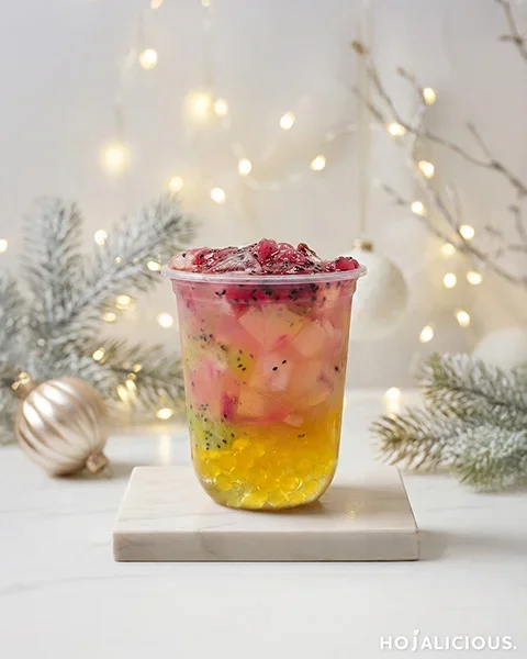 Tropical dragon fruit iced tea with mango, kiwi jam, dragon fruit, and popping pearls