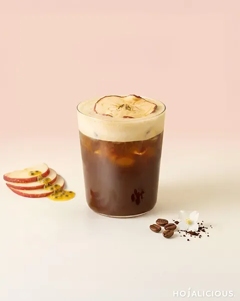 Passion Fruit Apple Cold Brew made with smooth cold brew coffee, passion fruit syrup, apple juice, and served over ice.