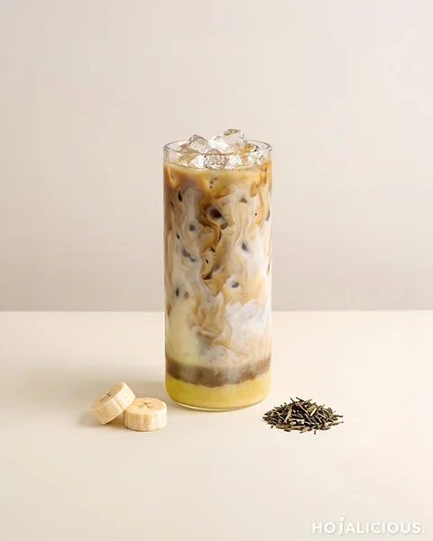 Hojicha banana milk — a layered iced milk drink with banana, cane-sugar milk, and amber roasted hojicha tea