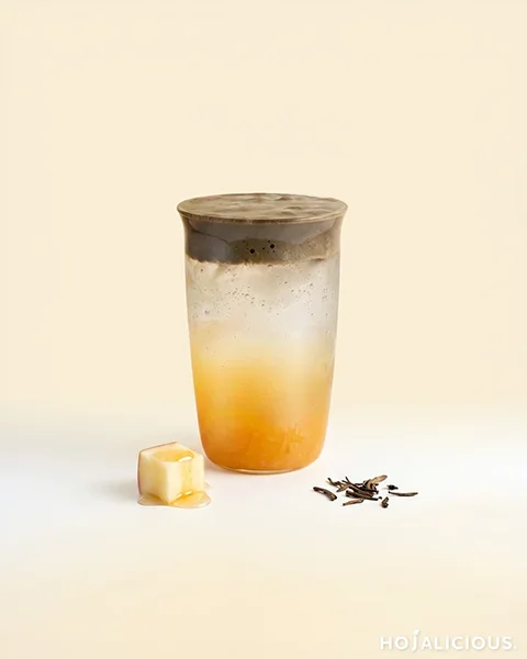 Apple Hojicha Sparkling Water — a layered drink with a bright apple base, sparkling water, and roasted hojicha cream foam on top.