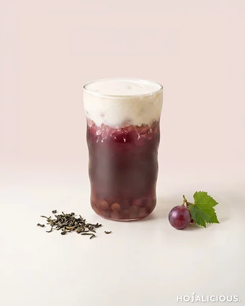 Grape Four Seasons Cream Tea made with Four Seasons Spring Tea, grape syrup, agar boba, ice, and original cream foam, featuring a purple grape tea base with chewy boba and smooth milk foam topping.