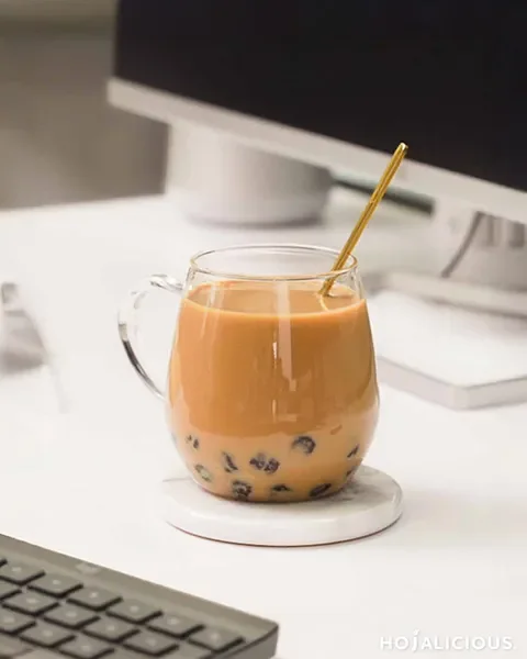 A comforting Hot Classic Milk Bubble Tea with a creamy milk tea base, rich caramel-like tea flavors, and chewy tapioca pearls, perfect for cozy moments.