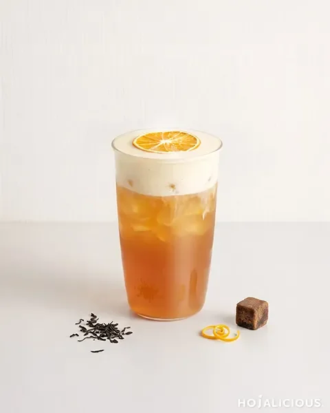Brown Sugar Orange Earl Grey made with Earl Grey tea, orange syrup, brown sugar milk foam, and a dried orange slice.