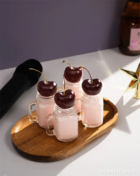 ENTP Cherry Muse Shot, strawberry syrup drink with fresh cherry garnish