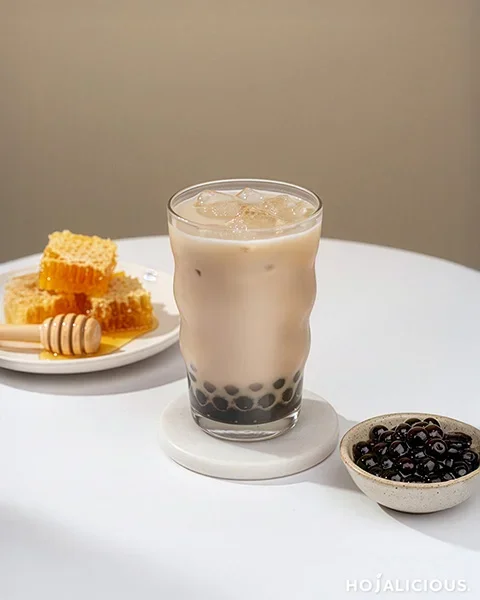 Honey Pu Erh Boba Milk Tea made with brewed Pu Erh tea, honey sweetness, smooth milk, and chewy tapioca pearls