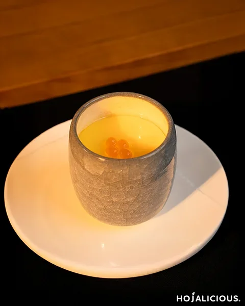 Smooth pudding dessert styled like chawanmushi topped with popping boba