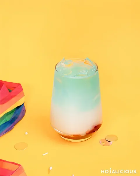 A Rainbow Cotton Candy Yakult Drink featuring strawberry jam, a refreshing Yakult layer, and a colorful cotton candy gradient that creates a vibrant and visually striking beverage.