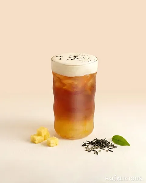 Pineapple Assam Cream Foam Tea made with Assam Black Tea, Pineapple Jam, Brown Sugar Syrup, and Original Flavor Foam, creating a layered cream foam tea with rich tea aroma, tropical fruit sweetness, and a smooth creamy finish.