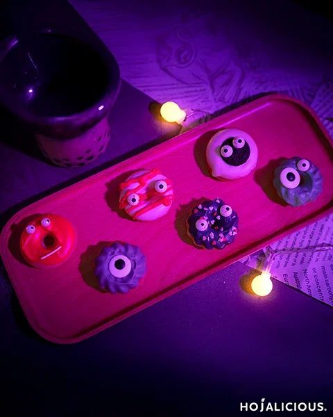 Fantasy style donut with lavender and mint glaze, sprinkles and playful toppings