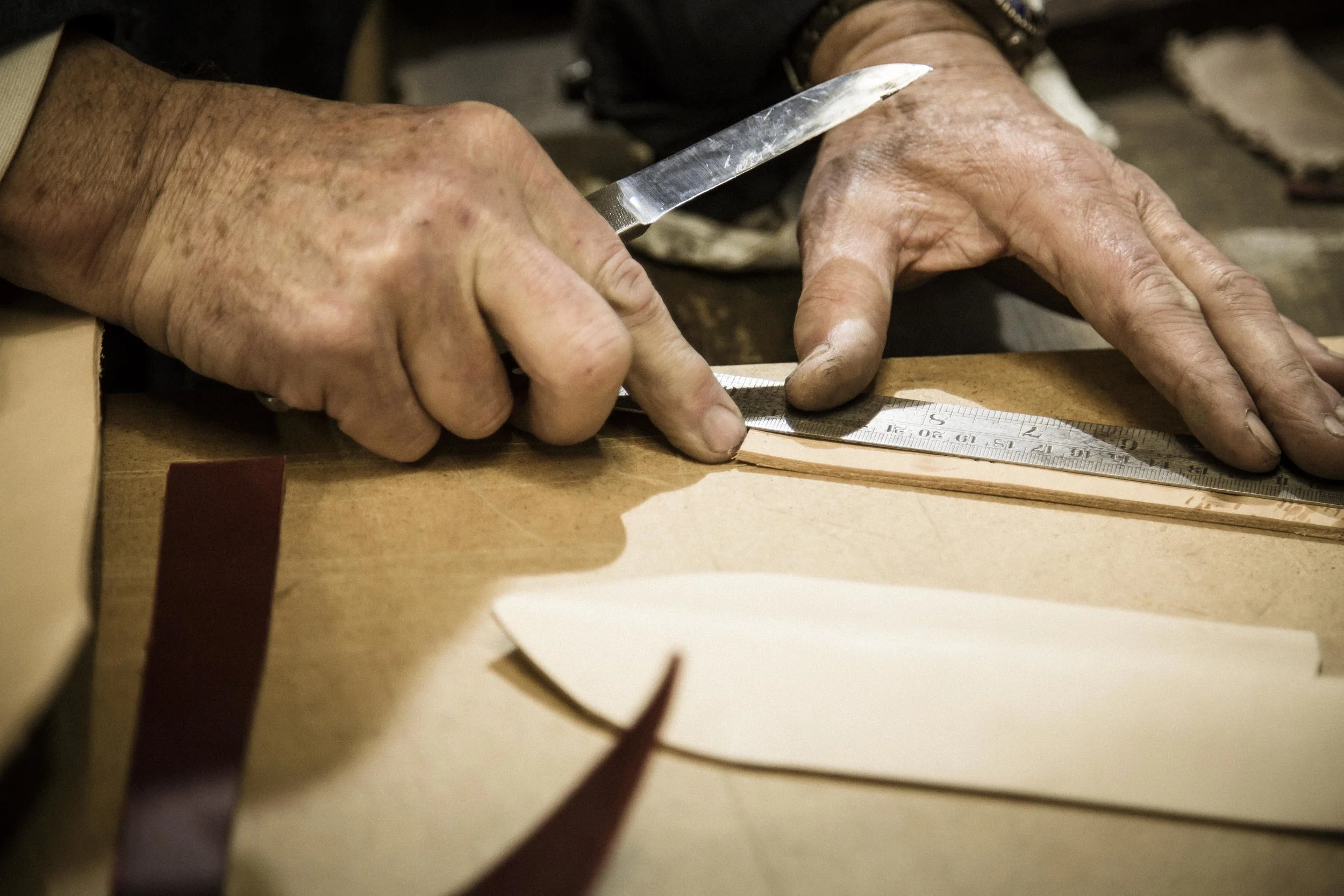 Measuring the leather to create the sheath