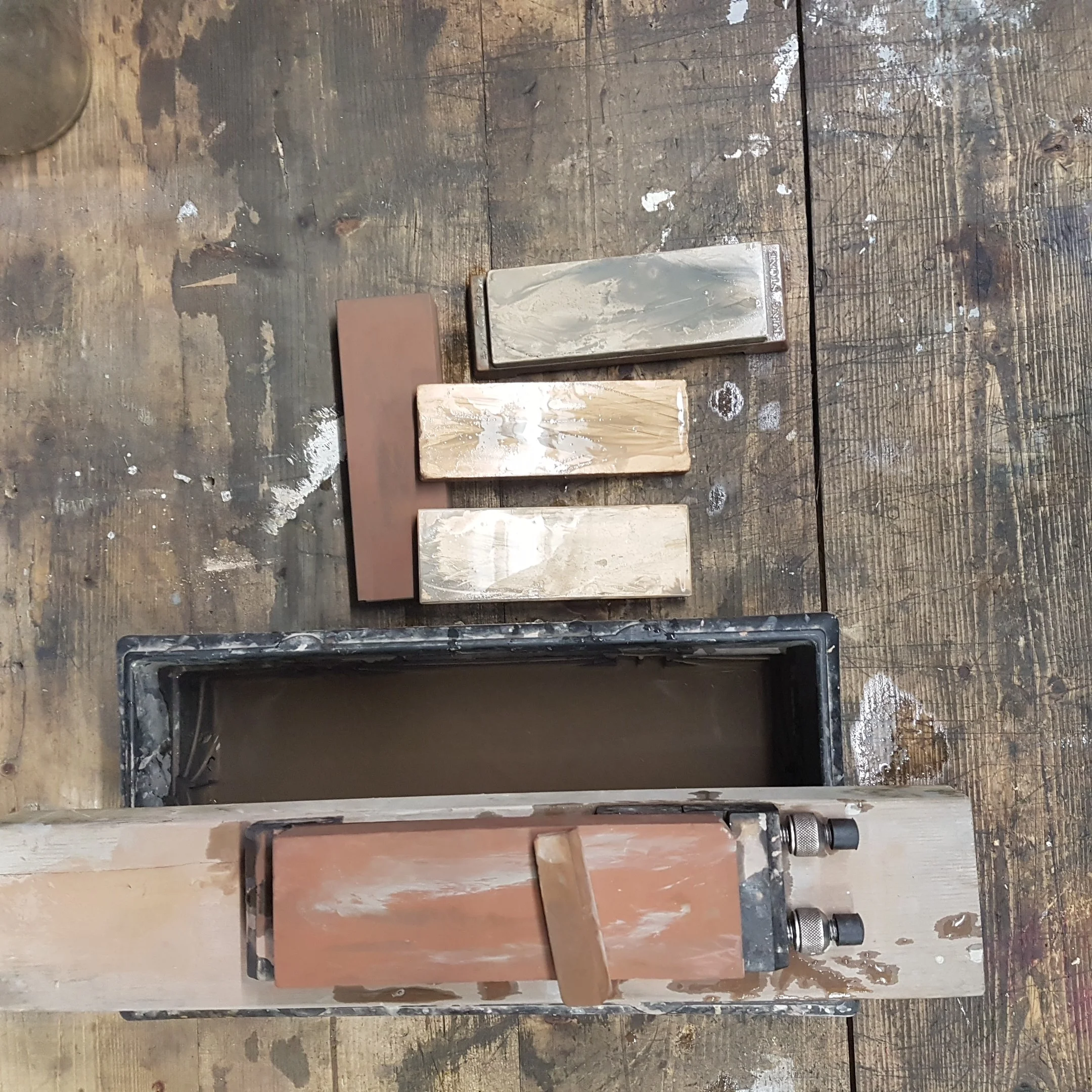 A selection of Japanese water stones from 800 to 8000 grit used to get the final mirror finished edge