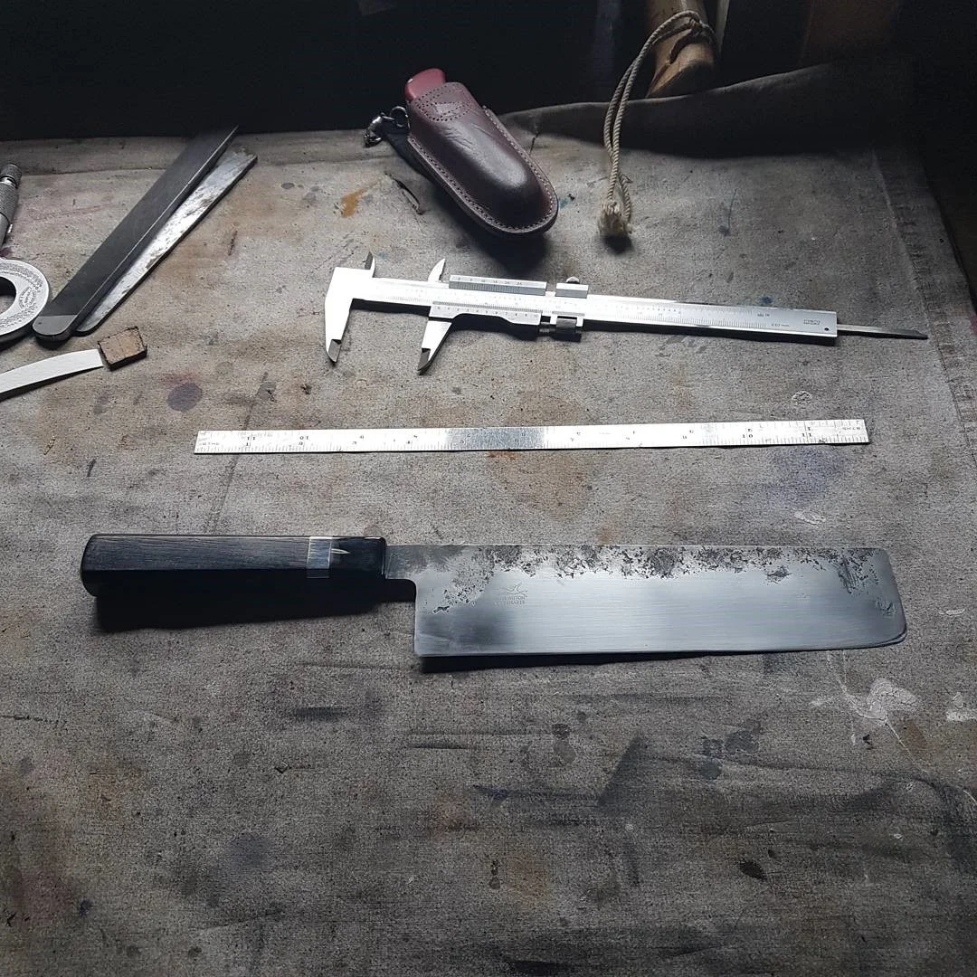 190mm Nakiri190mm Nakiri in 125sc heat treated to 65 Rockwell fitted with a Bog Oak, Buffalo handle with a nickel silver spacer. This blade was forged super thin for an experienced chef, a perfect kitchen vegetable knife.