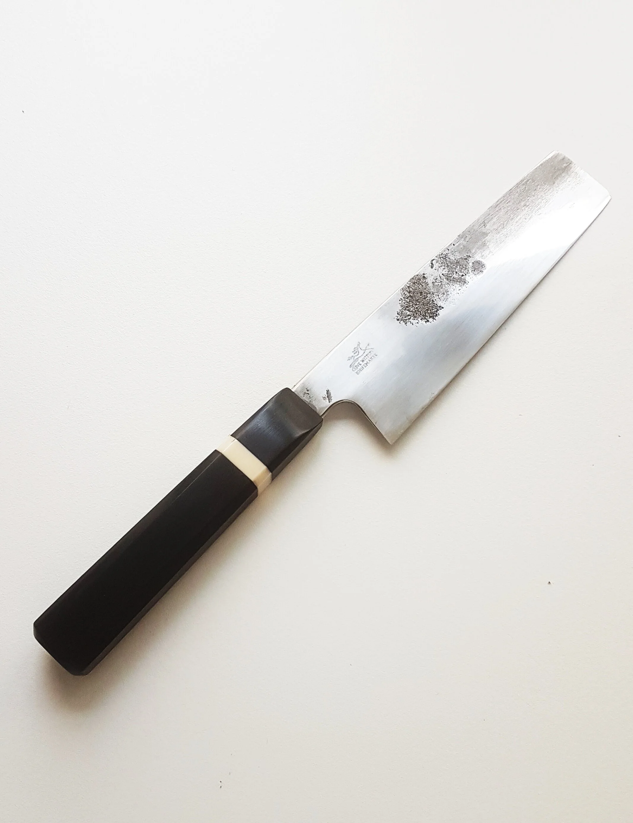 155mm Nakiri&nbsp;The blade is hand-made from 52100 steel also known as AISI L3 and is mostly recognised in its use for ball bearing manufacture. The composition is nominally Carbon 1.0%, Chrome 1.3 – 1.7%, Vanadium 0.1 – 0.3%, Manganese 0.25 – 0.8%…