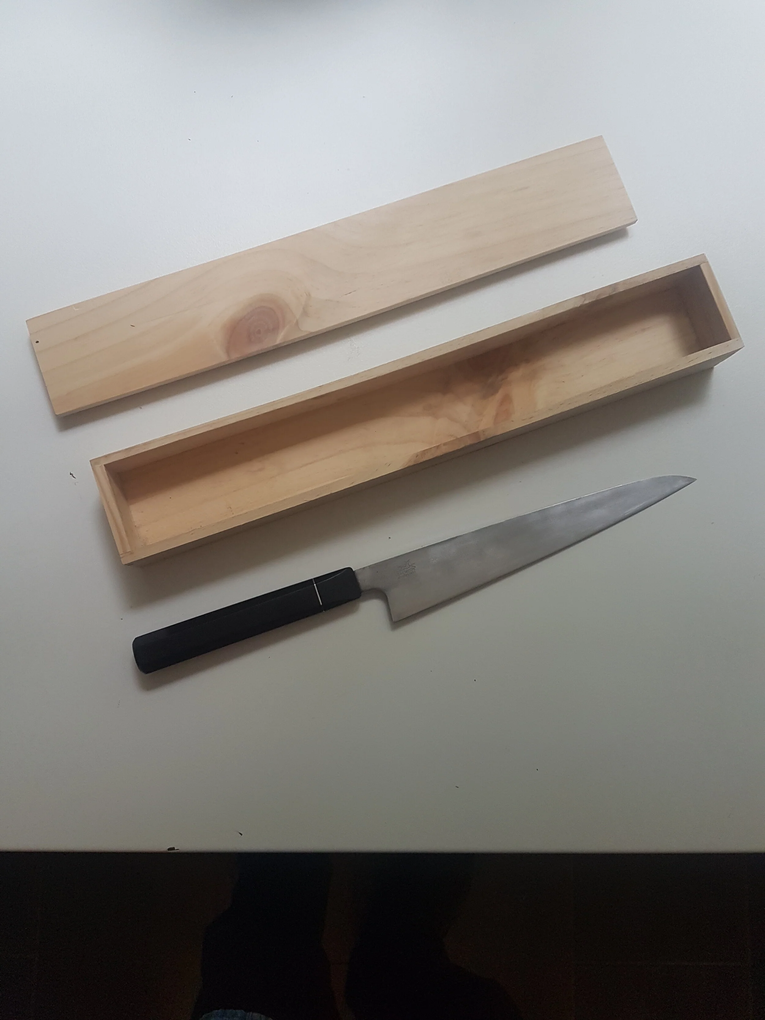 220mm GyutohikiThis Gyutohiki has been entirely handmade from hand-forged from SC125sc a high carbon steel made from Armco pure iron #4 (the purest commercially available iron), in a foundry in Witten, Germany that only produce specialised steels. C…