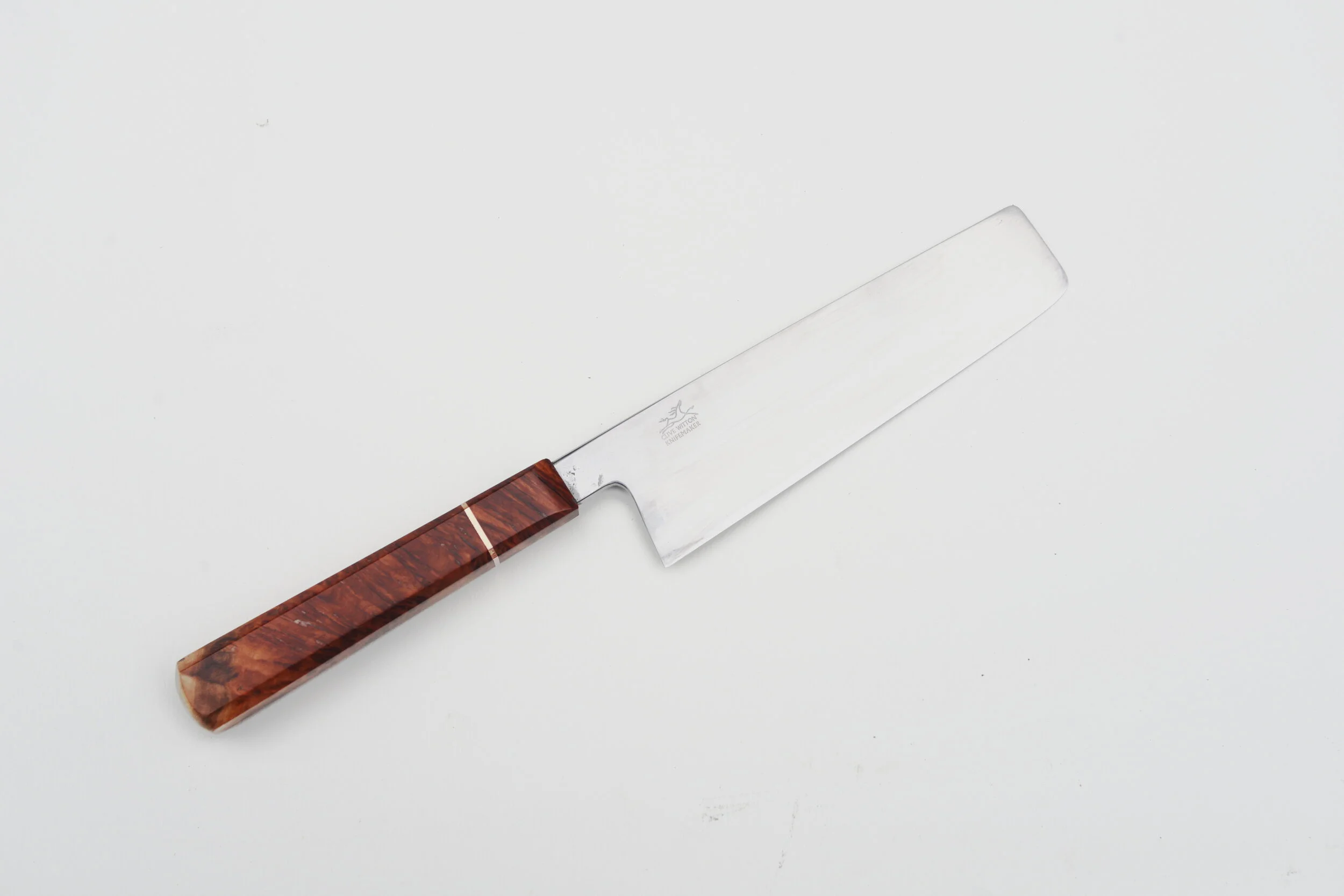 155mm NakiriThis Nakiri was hand-made from 52100 steel also known as AISI L3 and is mostly recognised in its use for ball bearing manufacture. The composition is nominally Carbon 1.0%, Chrome 1.3 – 1.7%, Vanadium 0.1 – 0.3%, Manganese 0.25 – 0.8%, S…