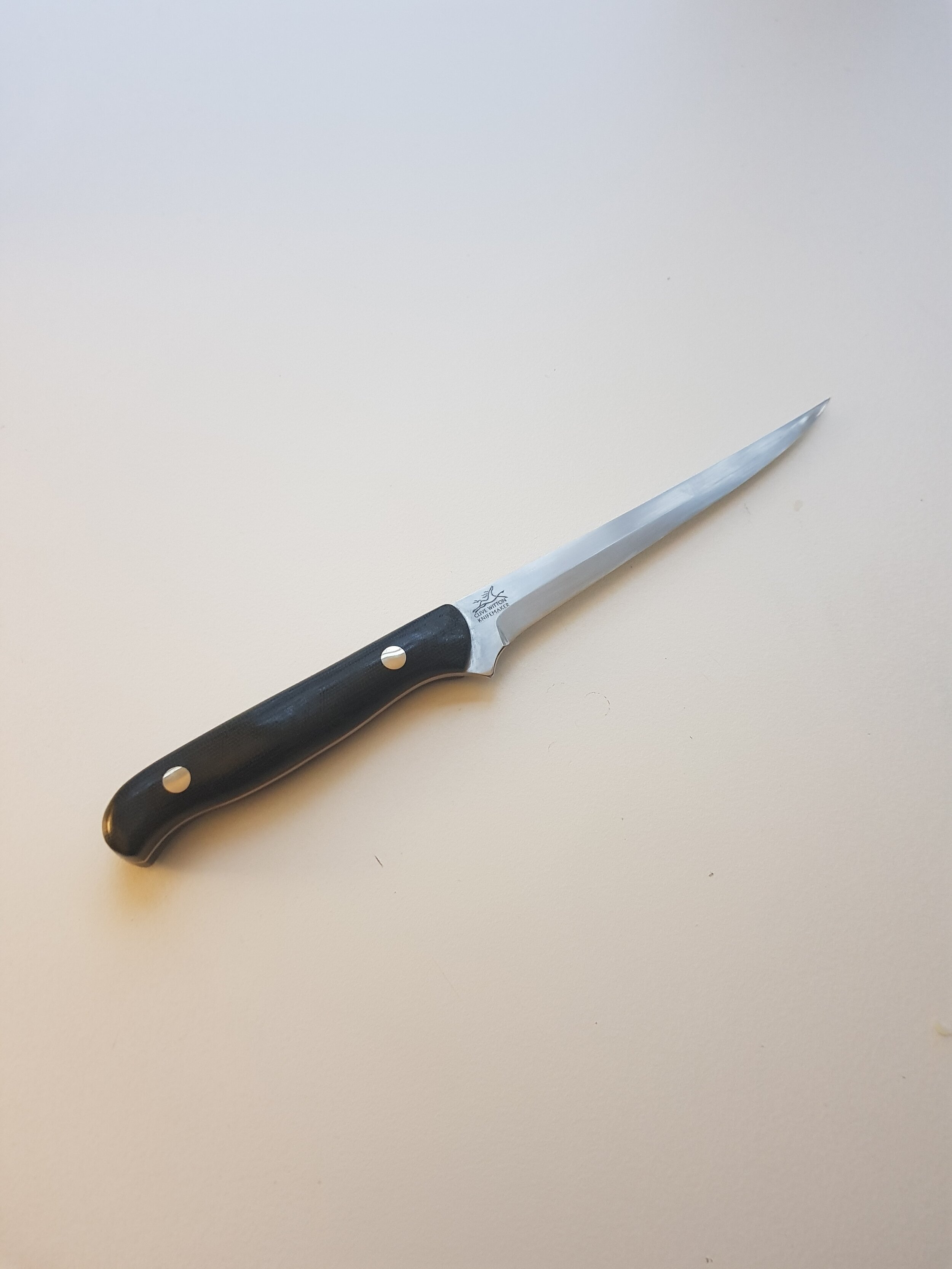 Boning KnifeThis Boning Knife blade is 14C28N cutlery steel; this is a super fined-grained steel made by Sandvik in Sandviken, Sweden. Heat treated to 62 degrees on the Rockwell C scale; it will hold a sharp and effective edge. The steel contains 14…