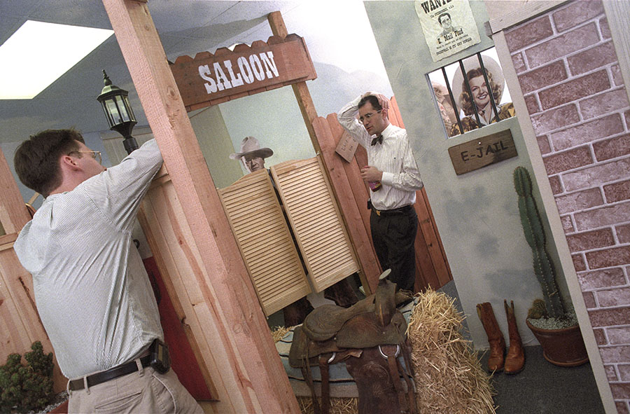Neil Peretz chatting to one of his employees in the 'OK Corral' themed room at PocketScience - the 'mobile email' start-up he founded back in 1995. 