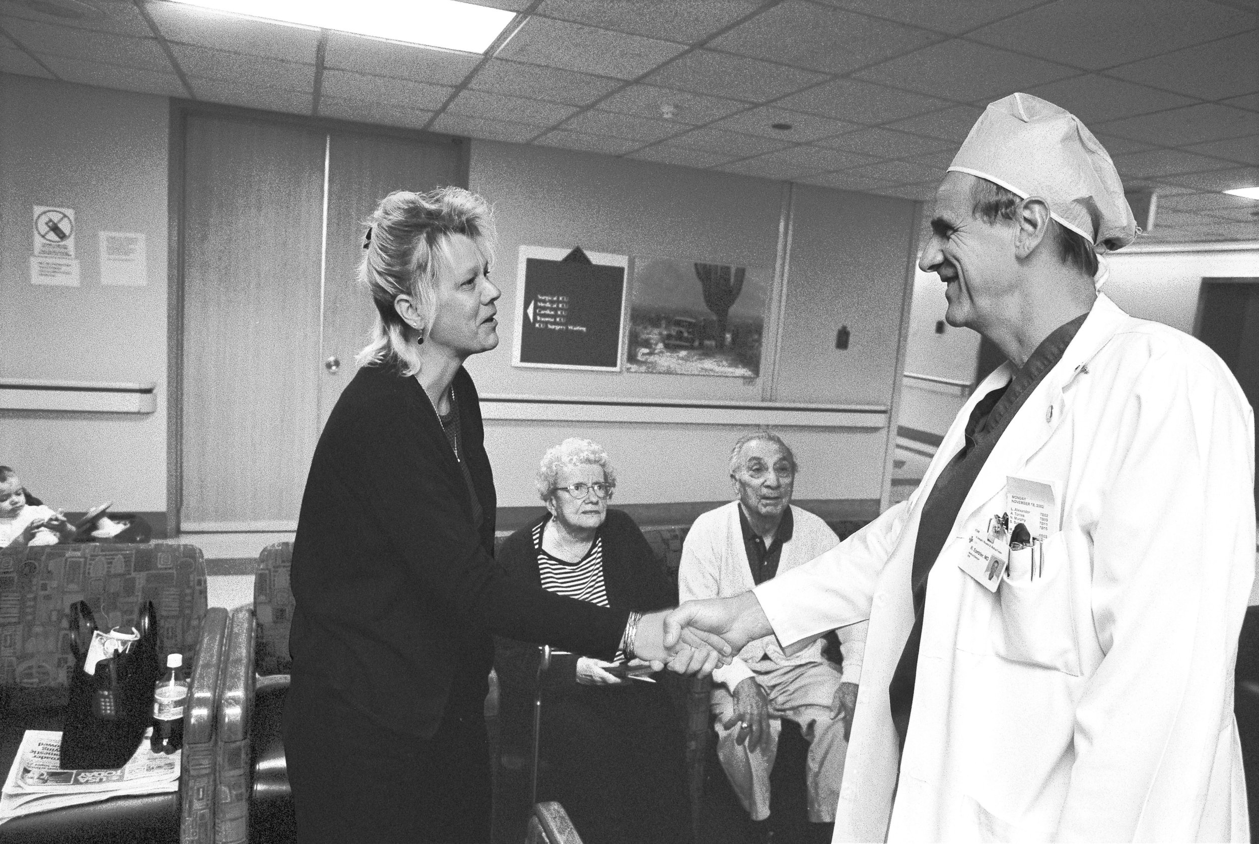  Dr. Spetzler giving the good news to the loved ones of patient on whom he has successfully operated. He had 'defused' an aneurysm buried deep within the patient's brain.&nbsp; 