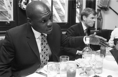 Nigeran-born Adedayo Adebayo played for Bath 66 times and won 6 caps for England on the wing. Seen here cutting a deal with a business colleague over lunch – he worked for the family business back then.