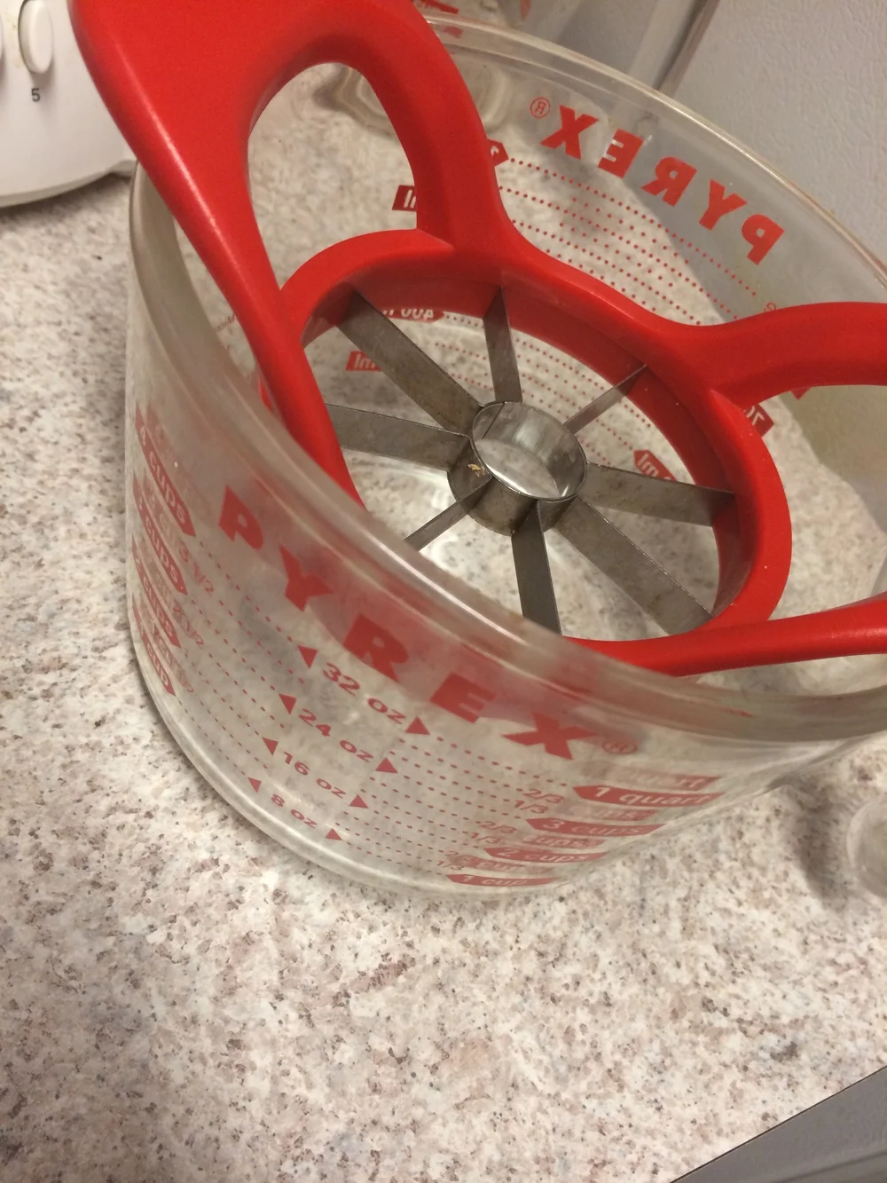 I don't have a fine enough mesh strainer, so I decided to use a measuring cup and rest an apple corer on top to drape the cheesecloth over. 
