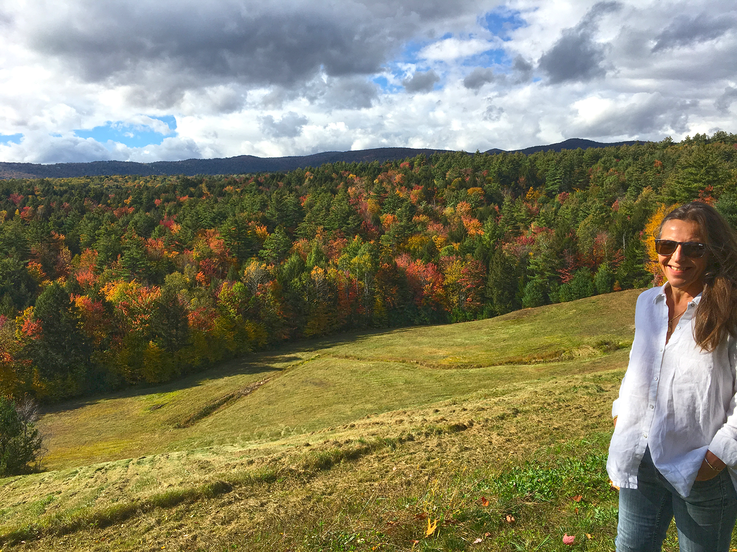 Nancy Shaw overlooking the field below Adams Hill House