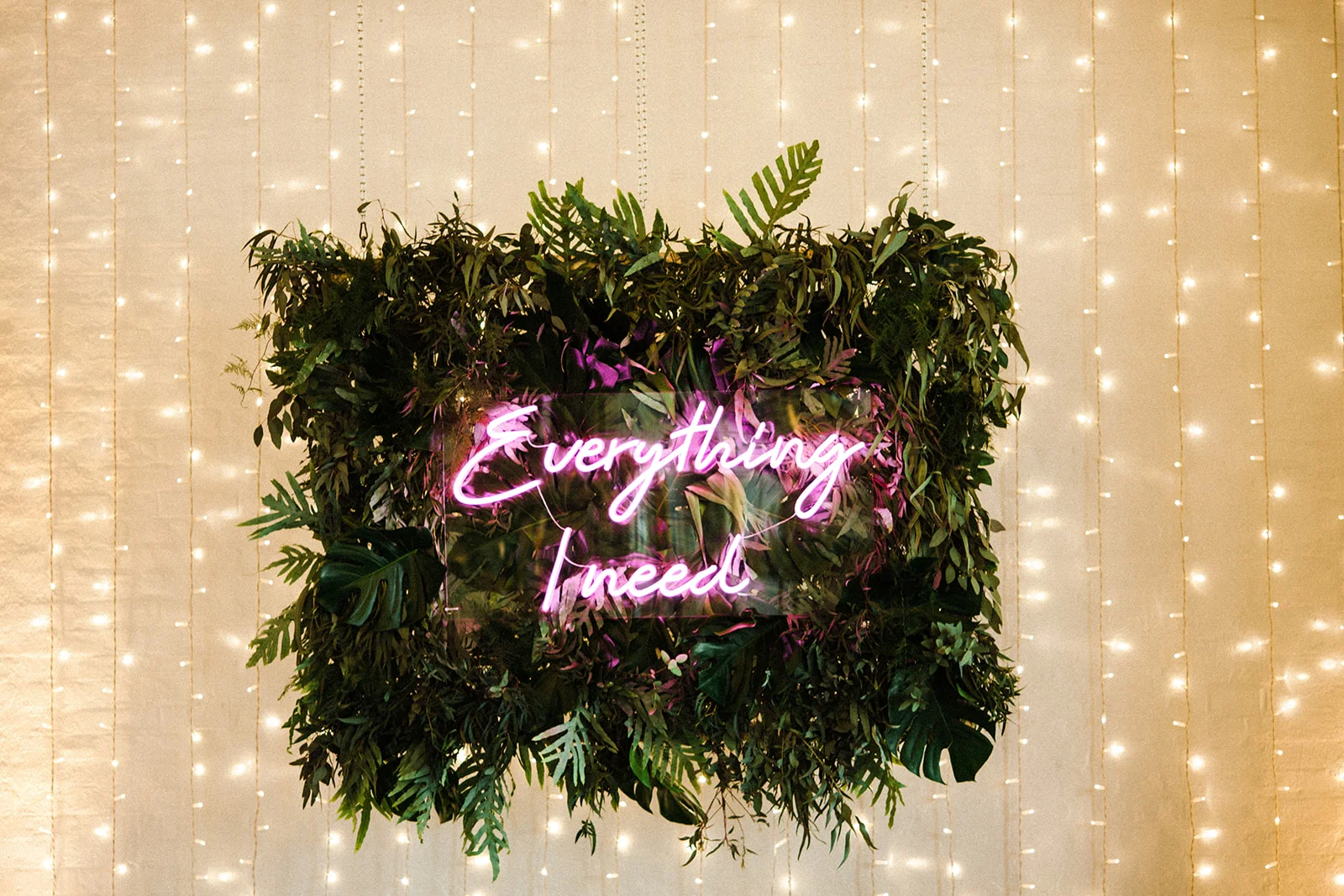 Neon wedding sign with foliage