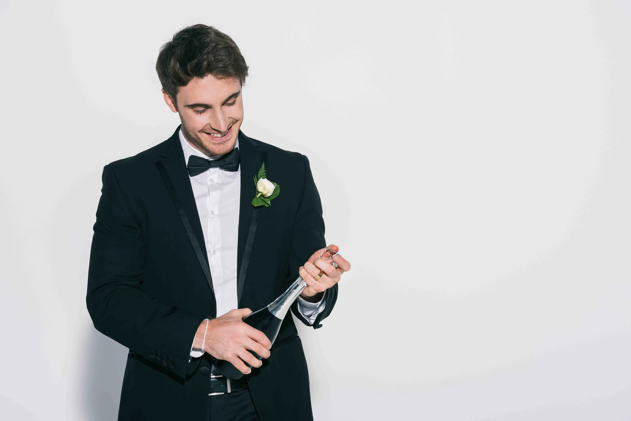 Best man raising a glass to the newly married couple
