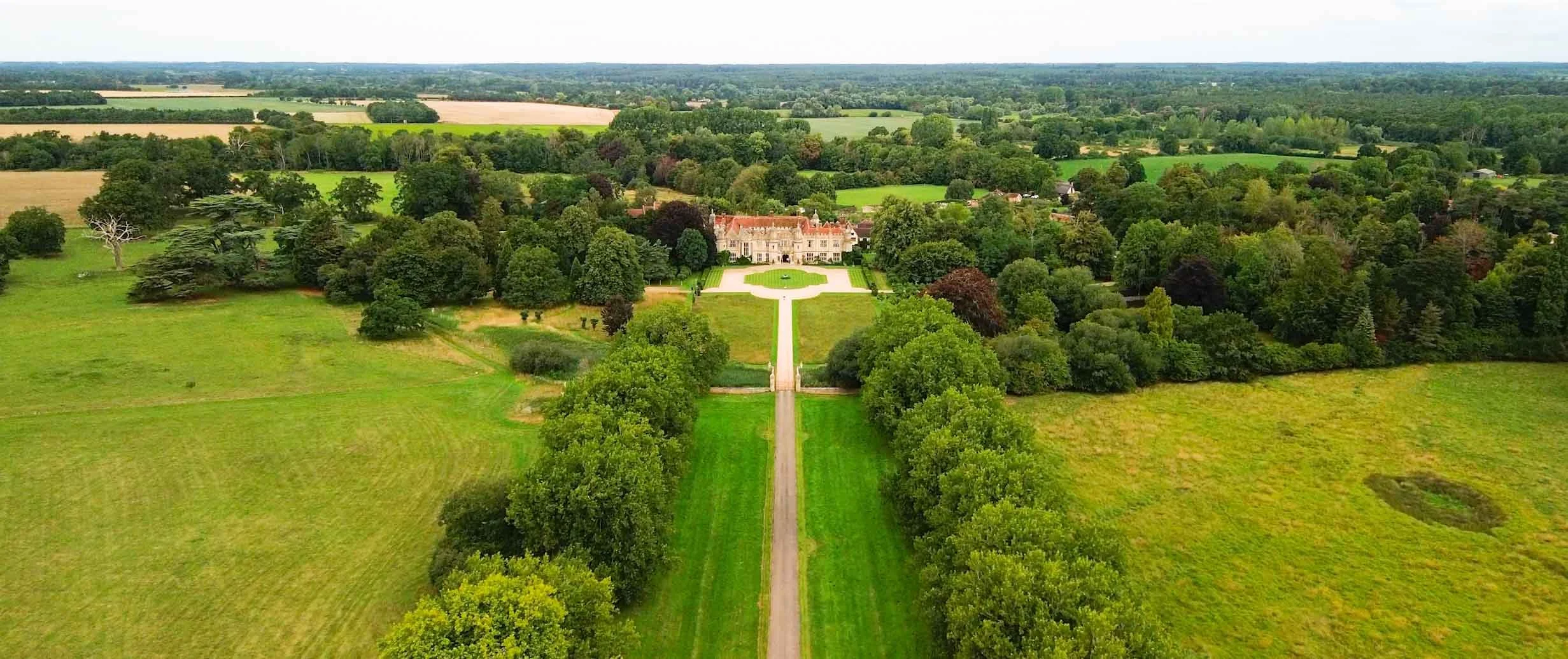 Hengrave Hall wedding venue in Suffolk surrounded by its grounds