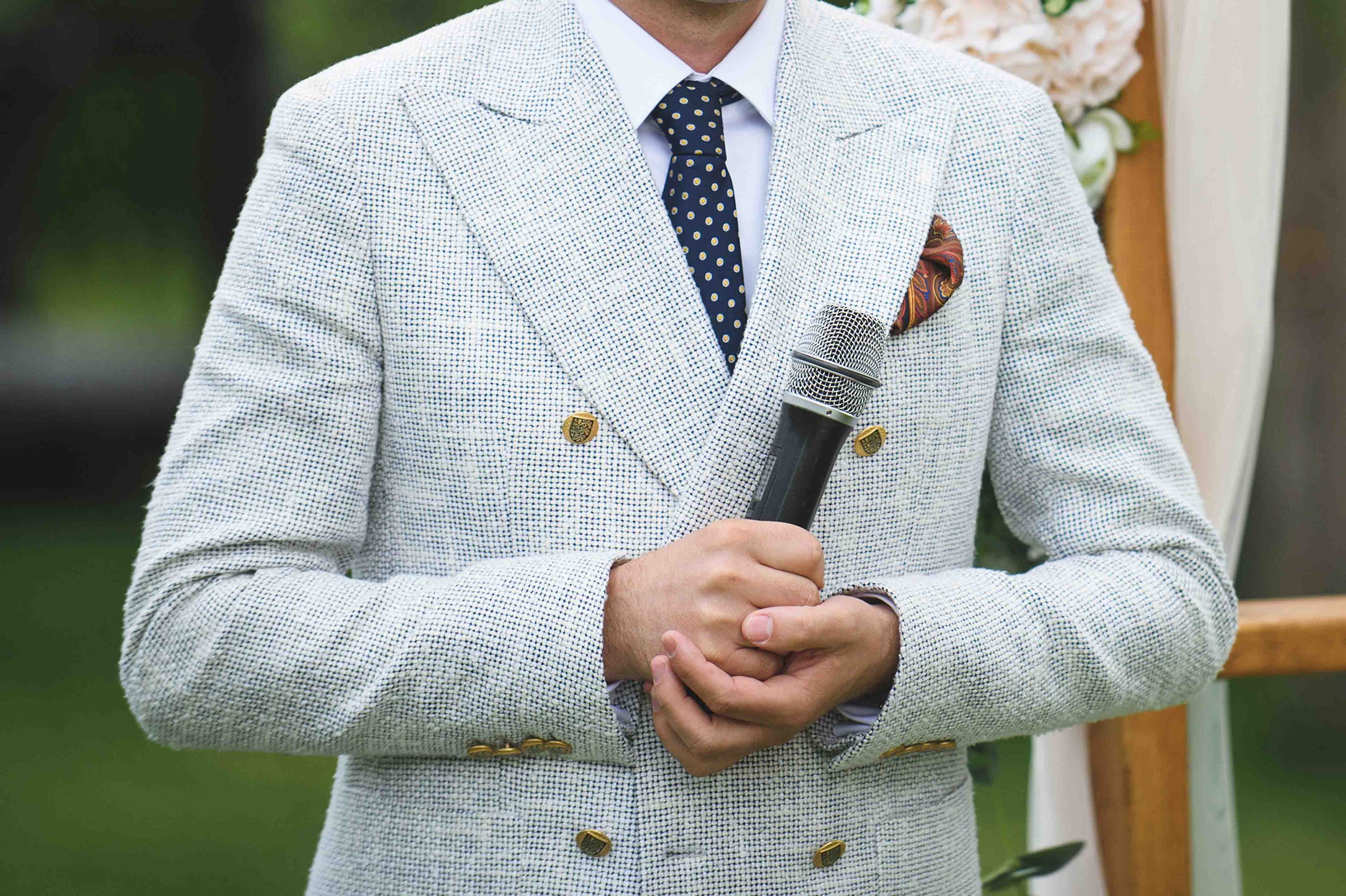 Best man delivering a wedding speech with a microphone