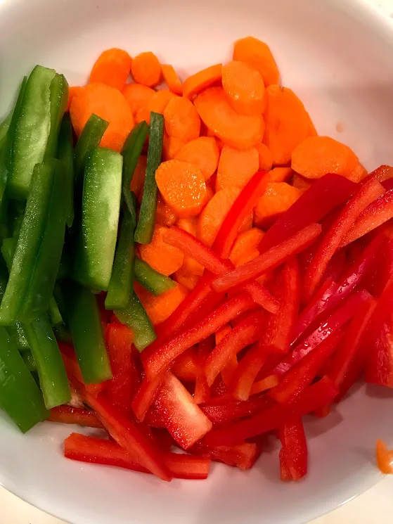 I love seeing a bunch of colors, sliced carrots and peppers, ready for dinner. I bought a pack of sugar snap peas from my HEB (Texas grocery store) so I didn't have to prep them.
