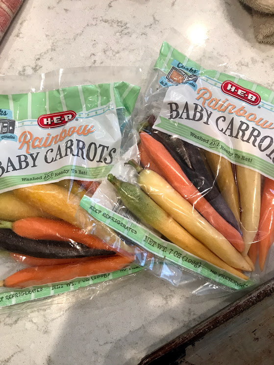 My grocery store, HEB, sells little packs of prepped rainbow baby carrots, perfect for this recipe. I also love to hit the farmer's market for rainbow carrots!
