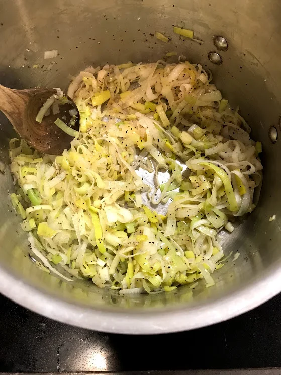 In a large pot, heat up the oil and throw in the dried leeks. Season with salt and pepper to help breaking them down.