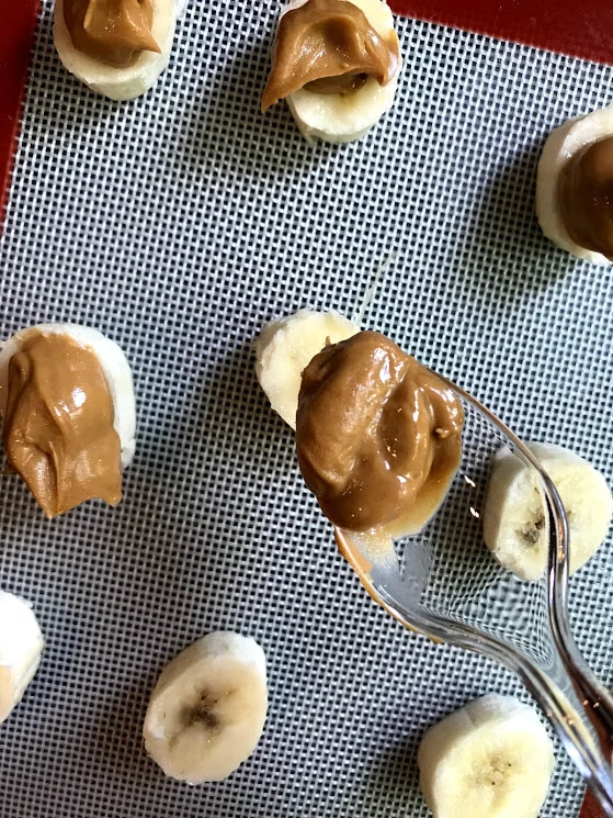 I actually found that using plastic spoons worked better so there is one upside to a kitchen reno! I just scooted a bit of peanut butter on each slice.