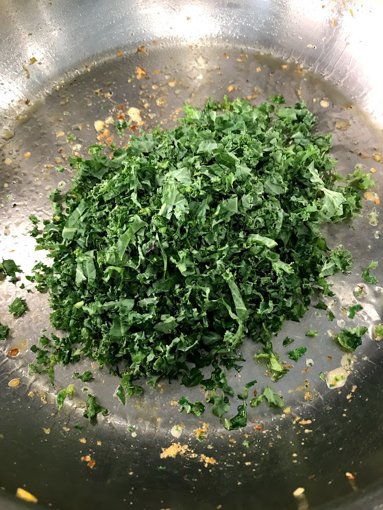 Now it's the kale's turn. You are just wilting it and making sure it loses the moisture. Cool this separately.