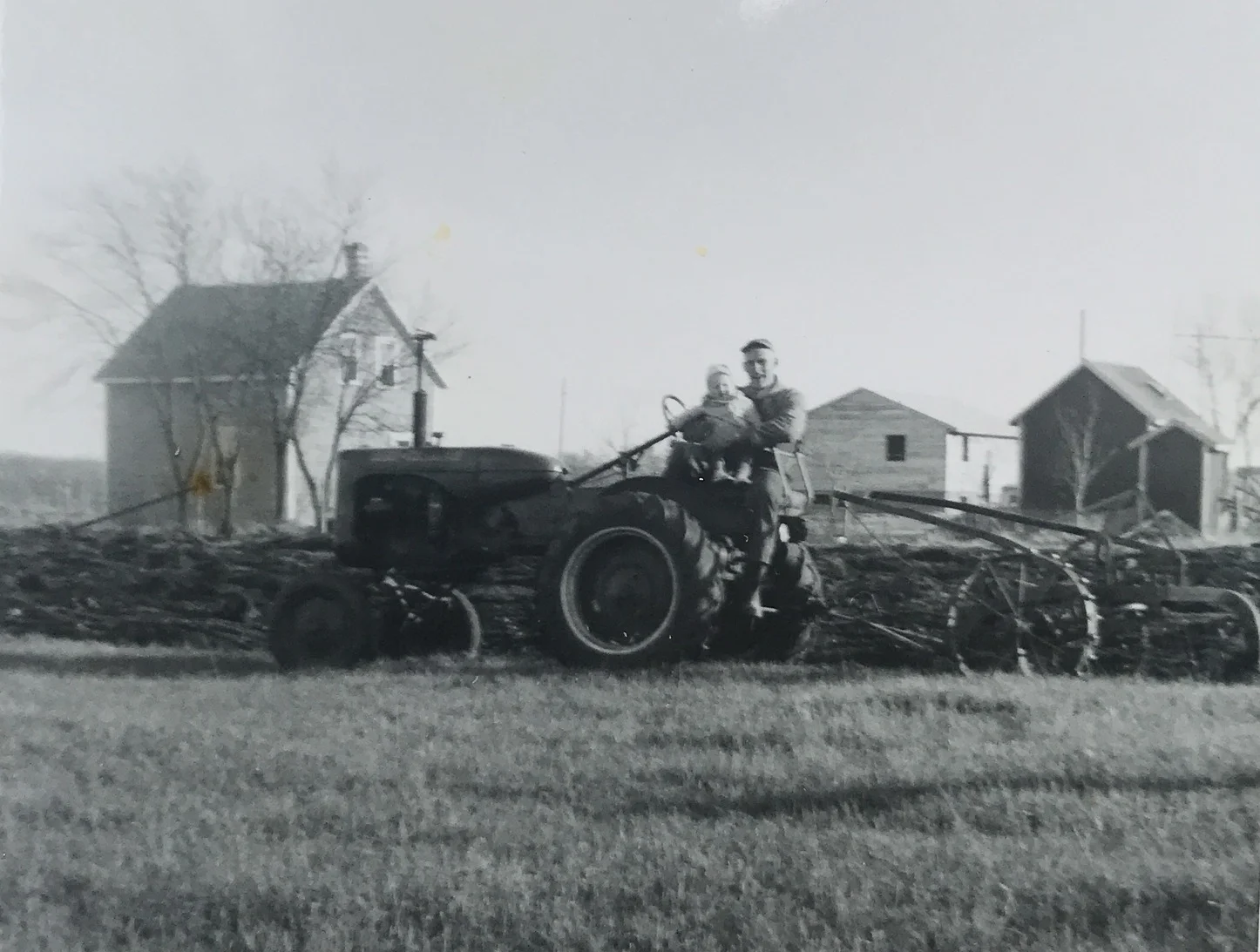 Louis with his daughter Diane on an Allis Chalmers B Tractor