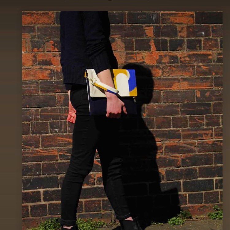 When social enterprise @kalopsiac put out a call for bright graphic fabric submissions for the annual photoshoot I was thrilled to have my fabric chosen and made into accessories. How cool is this clutch. Featuring navy wool fabric on the reverse and