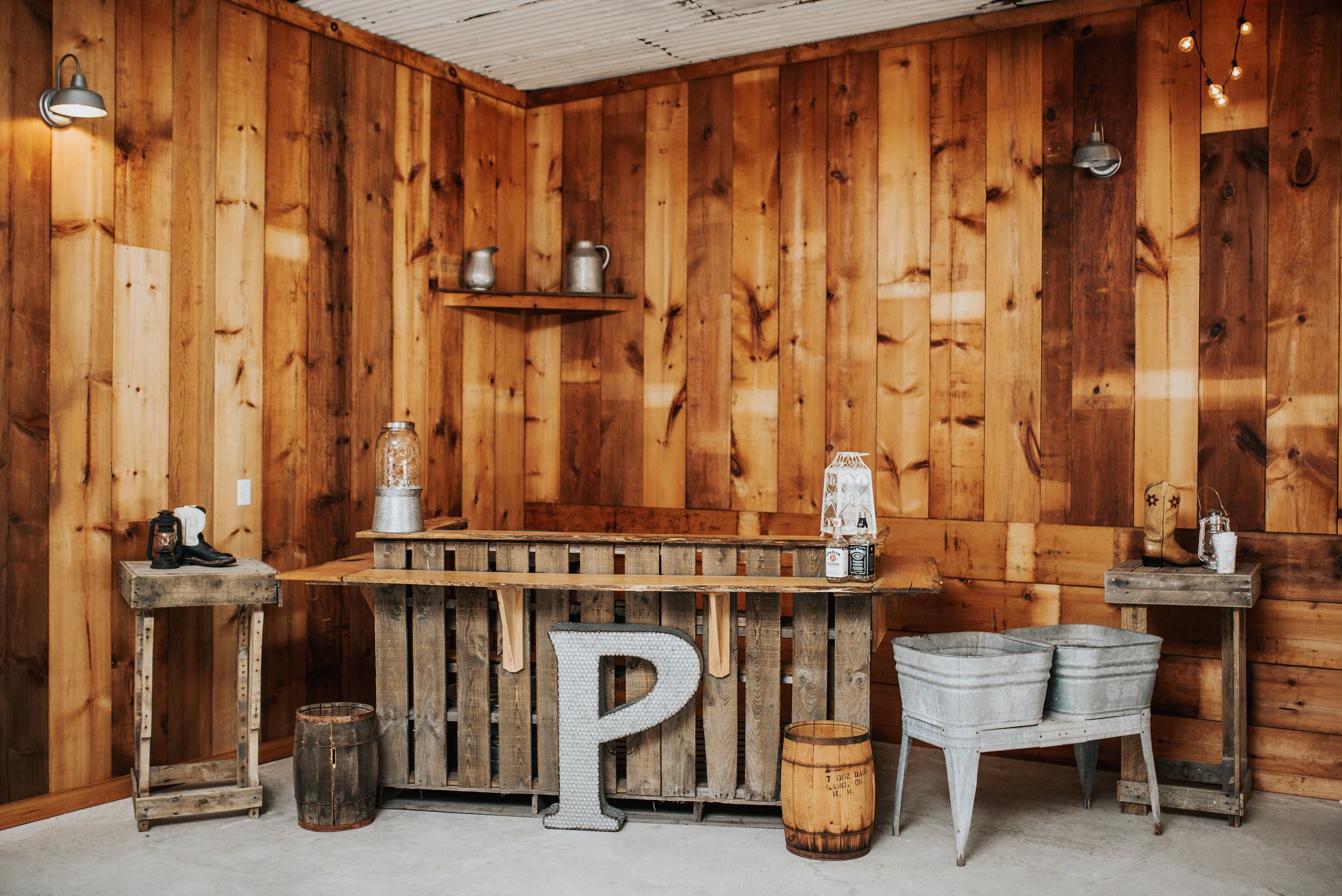 Photo by My Eight Photography Bar, tin sink and cocktail tables included in rental Decorations for rent by Hitched at Turkey Trac Farms, LLC