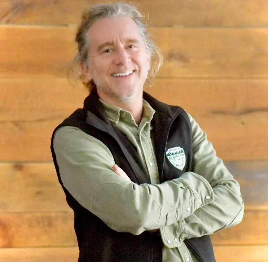 John Manning, Co-Founder and Head of Transportation & Client Services at Far Fetched Acres, smiling in a professional portrait.