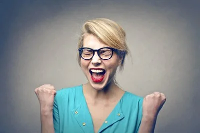 Woman celebrating and screaming with joy