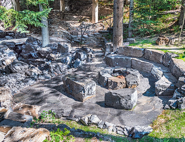 A stone fire pit featuring fire tables and features in the Calgary and Banff area