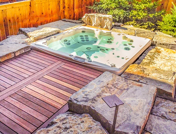 A sunken hot tub featuring a wooden deck in the Calgary and Banff area