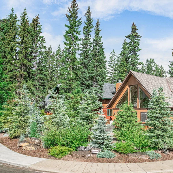 A front lawn complete with a garden in the Calgary and Banff area