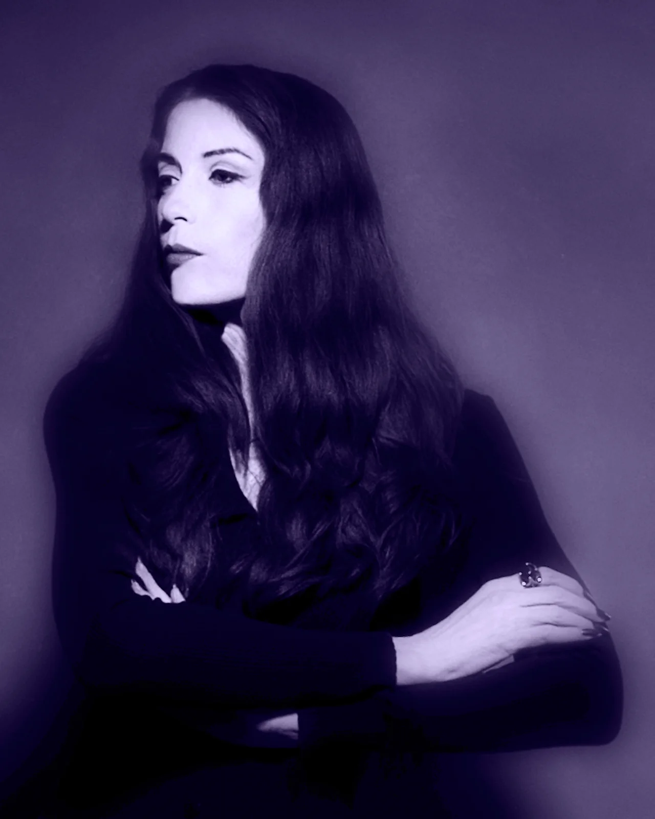 Nan Mac doing her best impression of Morticia Adaams, styled after the original character played by Caroline Jones.
