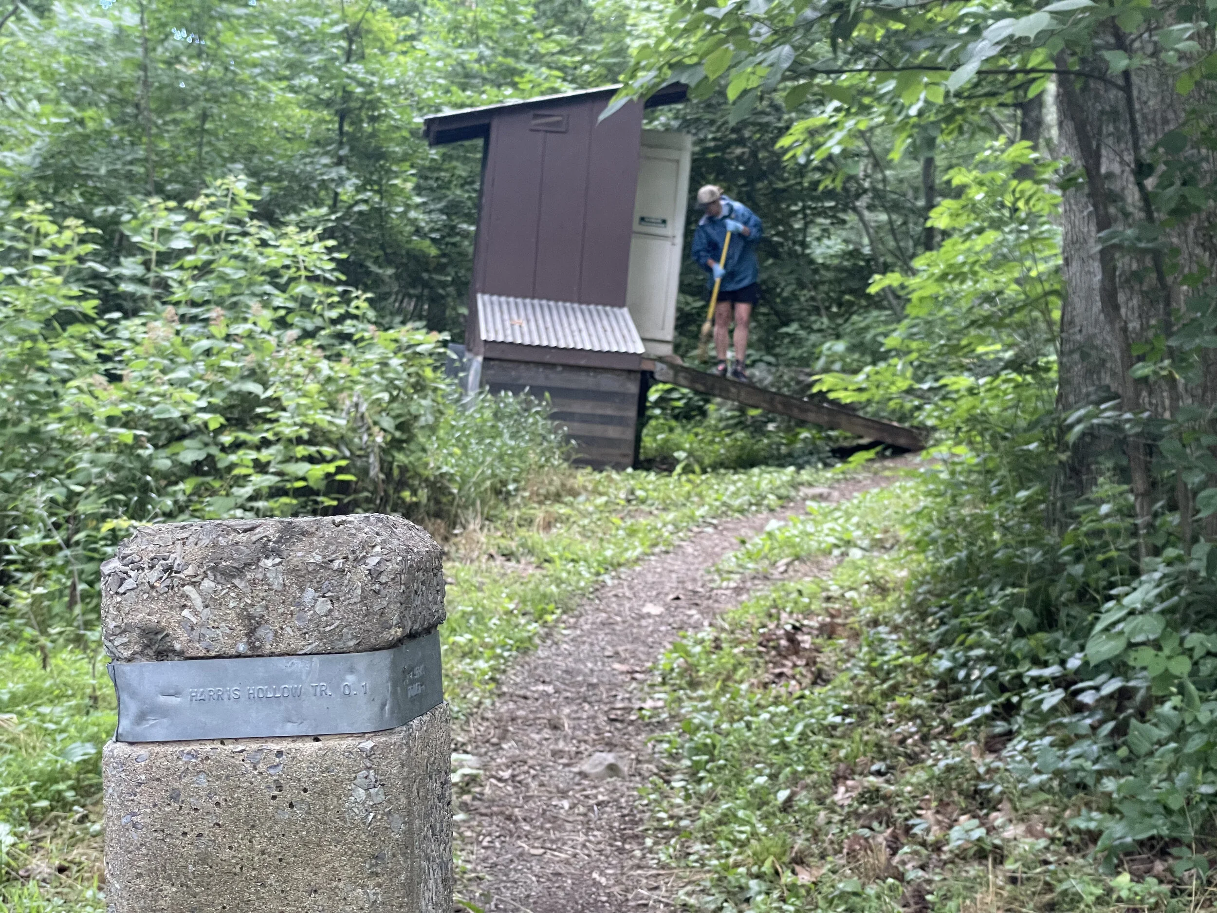 Cleaning the privy, photo by Jim Fetig