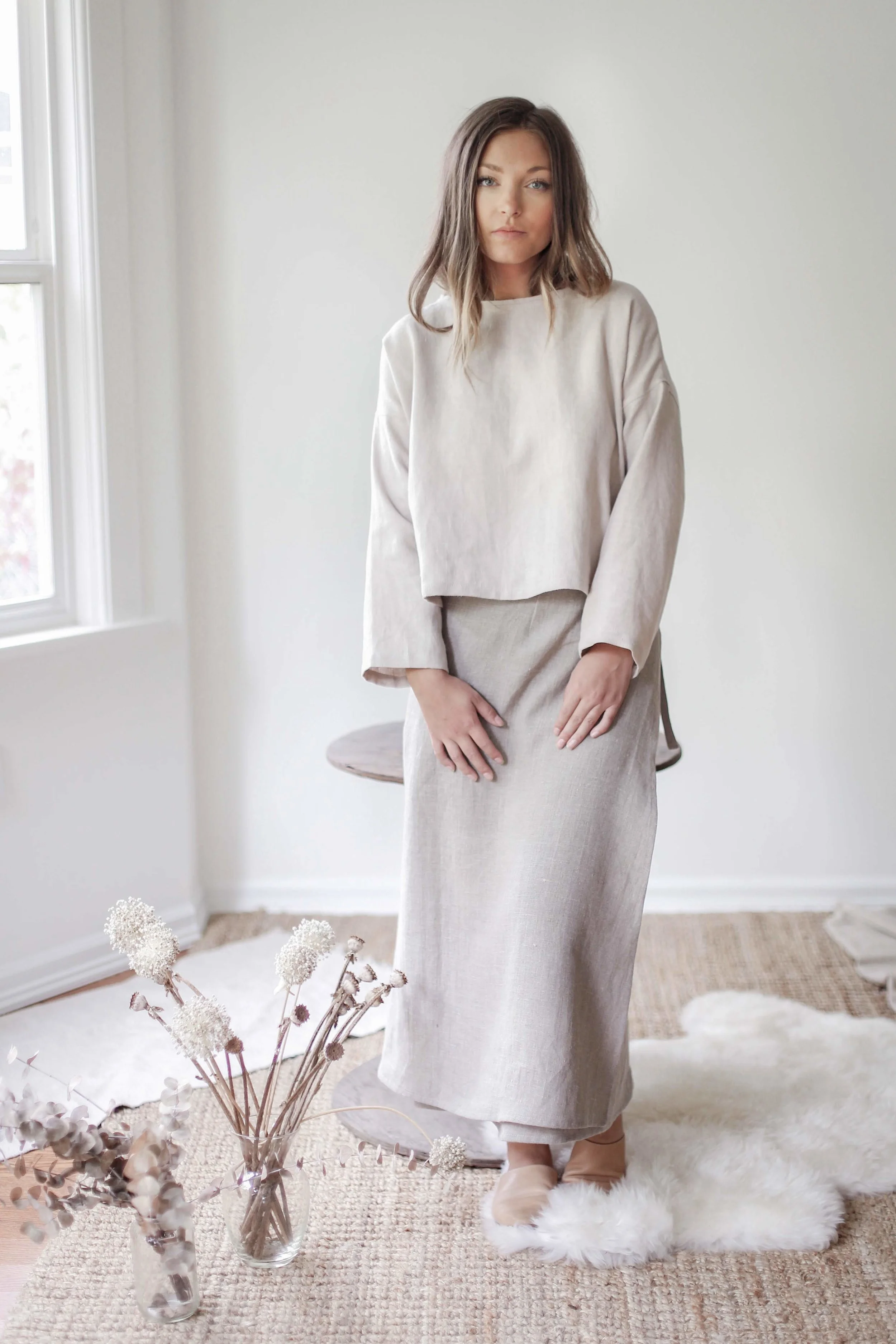 Handmade natural linen clothing by Nomi Designs in Victoria, BC | gleam colored long sleeve linen top with boat neck neckline - front styled with wrap skirt